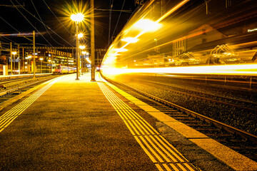 long exposure shot of a train entering the station, shot in Fribourg, Switzerland