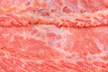 Raw red meat ambassador, pork neck background, close-up