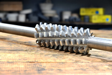 Spiral worm cutter on a rack after manufacturing.