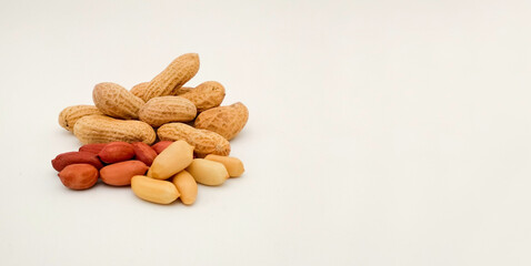 peanuts (Arachis hypogaeaon) white background with copy space