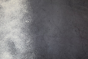 Cooking concept. Flour against a dark background. View from above.