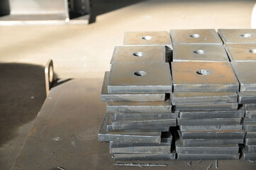 Plasma cutting of metal. Storing finished parts with a hole on a pallet.
