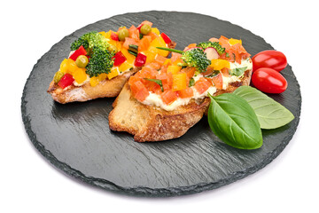 Assorted bruschetta with various toppings, isolated on white background. High resolution image