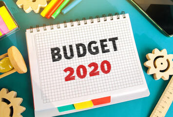 Notebook with inscription Budget 2020. Accumulating money and planning a budget. Business and...