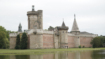 Obraz premium Laxenburg castle complex with lake and forest landscapes near Vienna, Austria.