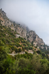 Amalfi coast cliff in fog in Italy
