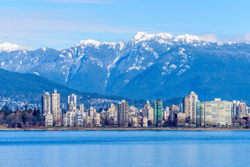 Fototapeta premium Fantastic view over ocean, yacht and snow mountains in Vancouver, Canada.