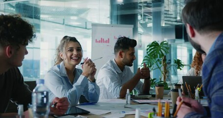 Close up of diverse colleagues discussing business ideas with company manager. Team of multicultural students having training seminar with female mentor. - Powered by Adobe