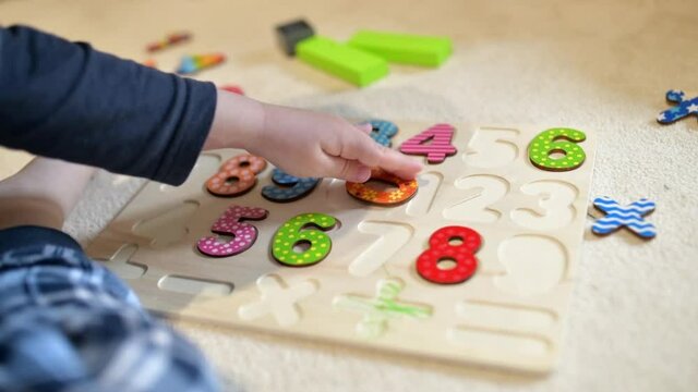 Toddler boy learning numbers