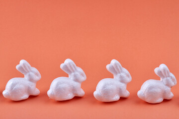 Miniature white bunnies side view.