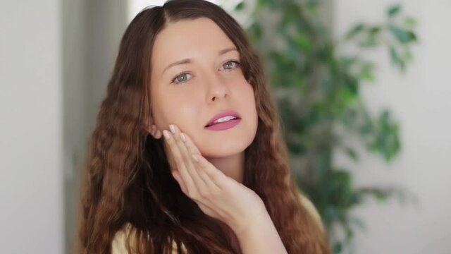 Beauty face portrait of beautiful woman, caucasian model gently touching her face as healthy skin care routine, luxury cosmetic, wellness and skincare commercial ad