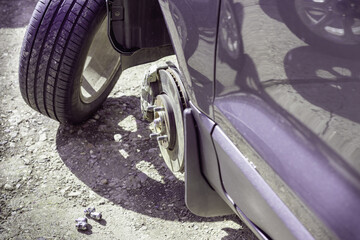 Car wheel repair and replacement on the road.