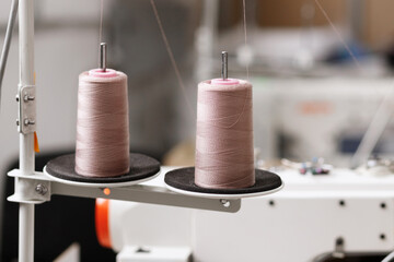 threads near the sewing machine at the factory