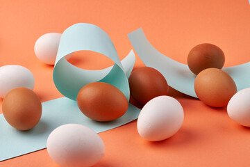 Eggs and colored paper pieces.