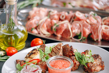 meat marinated for barbecue grilled and served on a white plate