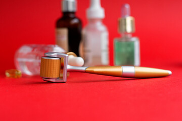 Dermaroller needle with serum in glass bottle. Anti wrinkle skin care. Beauty treatment,...