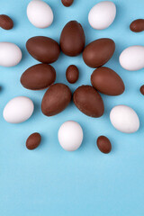 Top view composition of chocolate eggs.