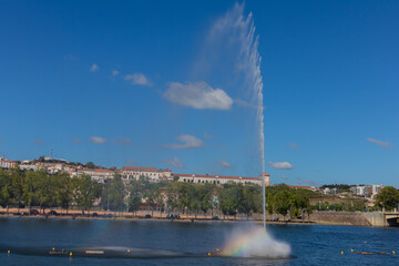 Naklejka na ściany i meble Water fountain over the Mondego river
