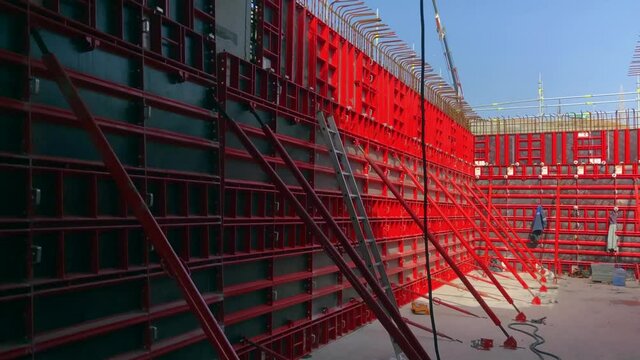 Formworks of reinforced concrete walls of tunnel under construction in an open foundation pit. Structures for cast in place reinforced concrete