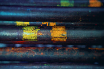 metal rods in mass, side view, metallurgy, steel, blurred background