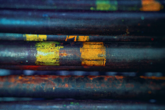 metal rods in mass, side view, metallurgy, steel, blurred background