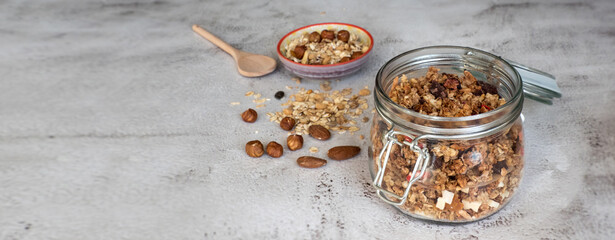 Home made granola with dried fruits and nuts in a mason jar