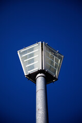 square street lamp against clear blue sky