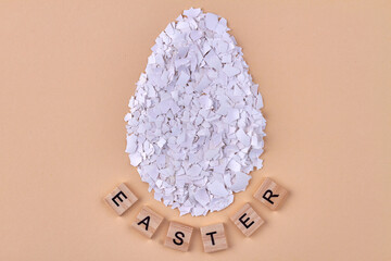 Huge egg made of broken eggshell pieces.