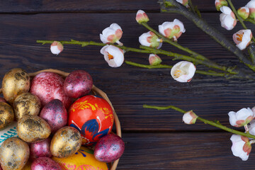 Colored foiled easter eggs and flowers.