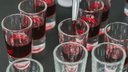 Alcohol cocktail with vodka and grenadine syrup