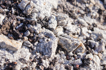 close-up of Old cracked asphalt pavement. concept of reduce reuse recycle. pile of smashed concrete. Disaster results, earthquake or accident. Destroyed highway, damage and collapse
