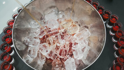 Mixed punch with fresh fruits in metal bowl