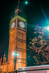 a clock tower lit up at night