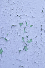 Cracked blue oil paint on aged metal surface. Cool grunge crackle texture. Fractured pattern. Peeling paint on Old wall. close up