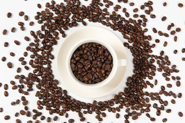 Coffee cup and coffee beans on white background