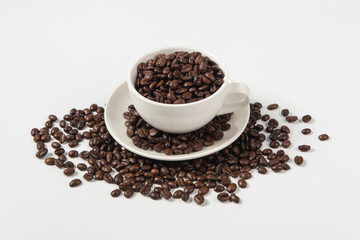 Coffee cup and coffee beans on white background