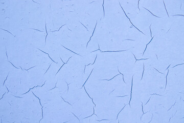 Old cracked paint on wall. Texture, pattern, background. The wall cracked with paint, abstract paint behind the iron. close up