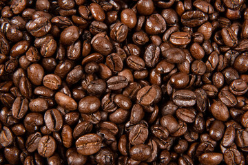 Freshly roasted coffee beans background. close up.