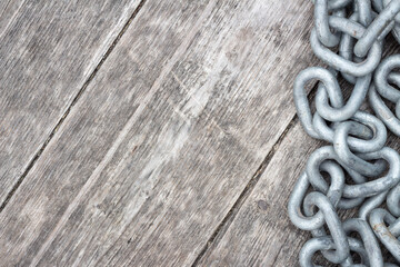 border of silver chain on rustic barn board weathered wood