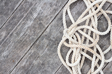 border of rope on barn board background with copy space