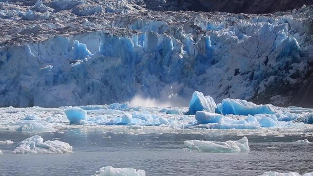 Hubbard Glacier Calving. Located in eastern Alaska near Juneau showing the amazing blue colours as the ice falls
