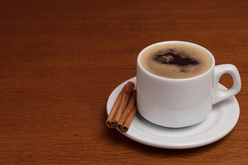 cup of black coffee with cinnamon