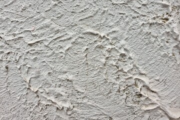 textured colored facing plaster of the street wall of the building