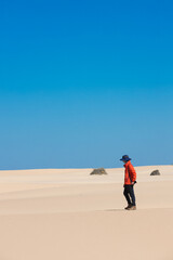 The man in red in the desert