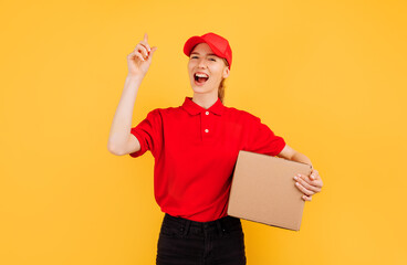 delivery in a red uniform holds a box of a parcel, on a yellow background,