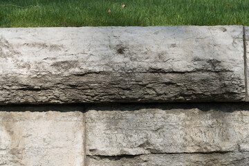 old stone wall with grass