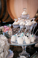 Catered cupcakes for a wedding ceremony with white frosting swirls