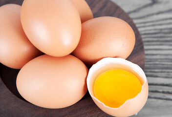 Fresh eggs in wooden plate