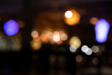 Abstract and blur of Bokeh lights in the restaurant at night.
