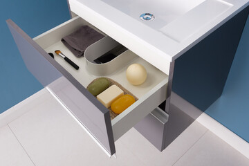Closeup shot of drawers with cosmetics and bathroom supplies